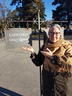 Photo of Linnea in front of Cafeteria sign
