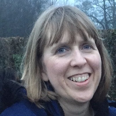 A photograph of Wendy, a white woman with fair hair smiling at the camera.