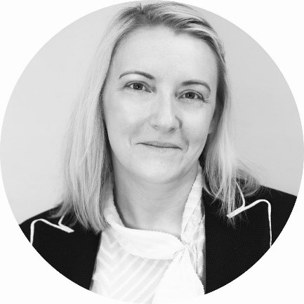 Photograph of Emma Vincent. She has blonde hair and is looking directly at the camera while smiling