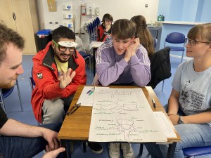 Several students learning and laughing. 