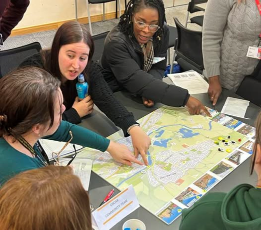 Students playing a tabletop game. 